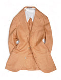 A pale peach colored sports jacket from Barba Napoli, with a mandarin collar, displayed on a mannequin. The jacket features a three-roll-two front closure, patch front pockets, and a chest pocket.