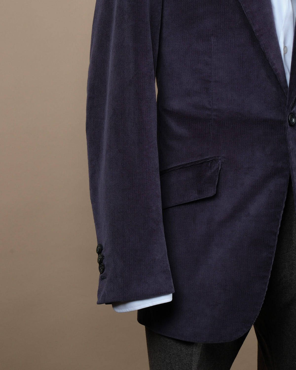 Detail of the open cuffs and slanted flap front pocket on the Navy Corduroy Sports Jacket by Cad & The Dandy. 