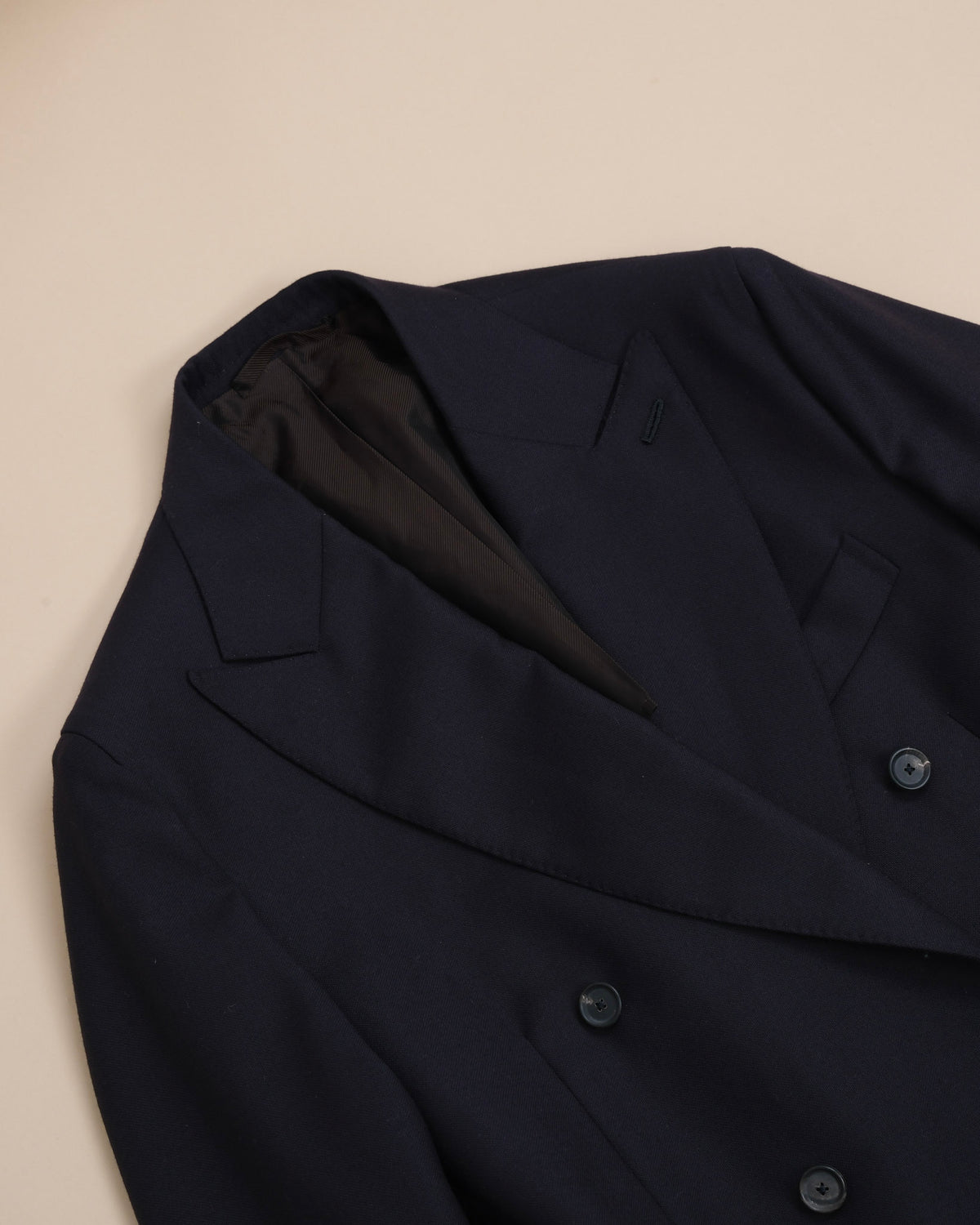 Detail of the generous peak lapels on the Navy Virgin Wool Hopsack DB. Suit by De Petrillo