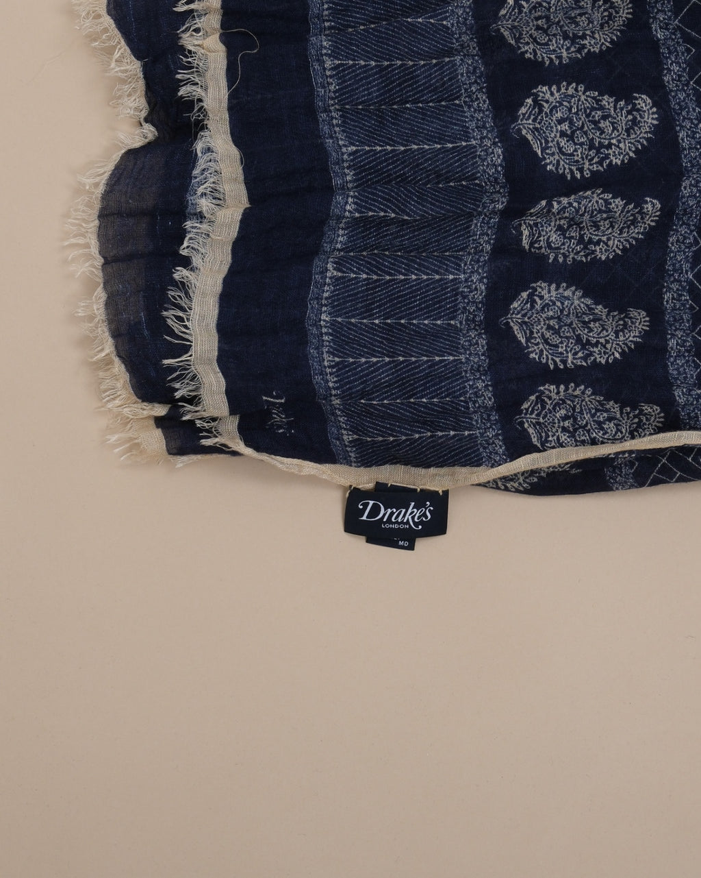 Detail of the logo and fringed sides on Navy Modal/Linen/Silk Navy Motif Scarf by Drake's