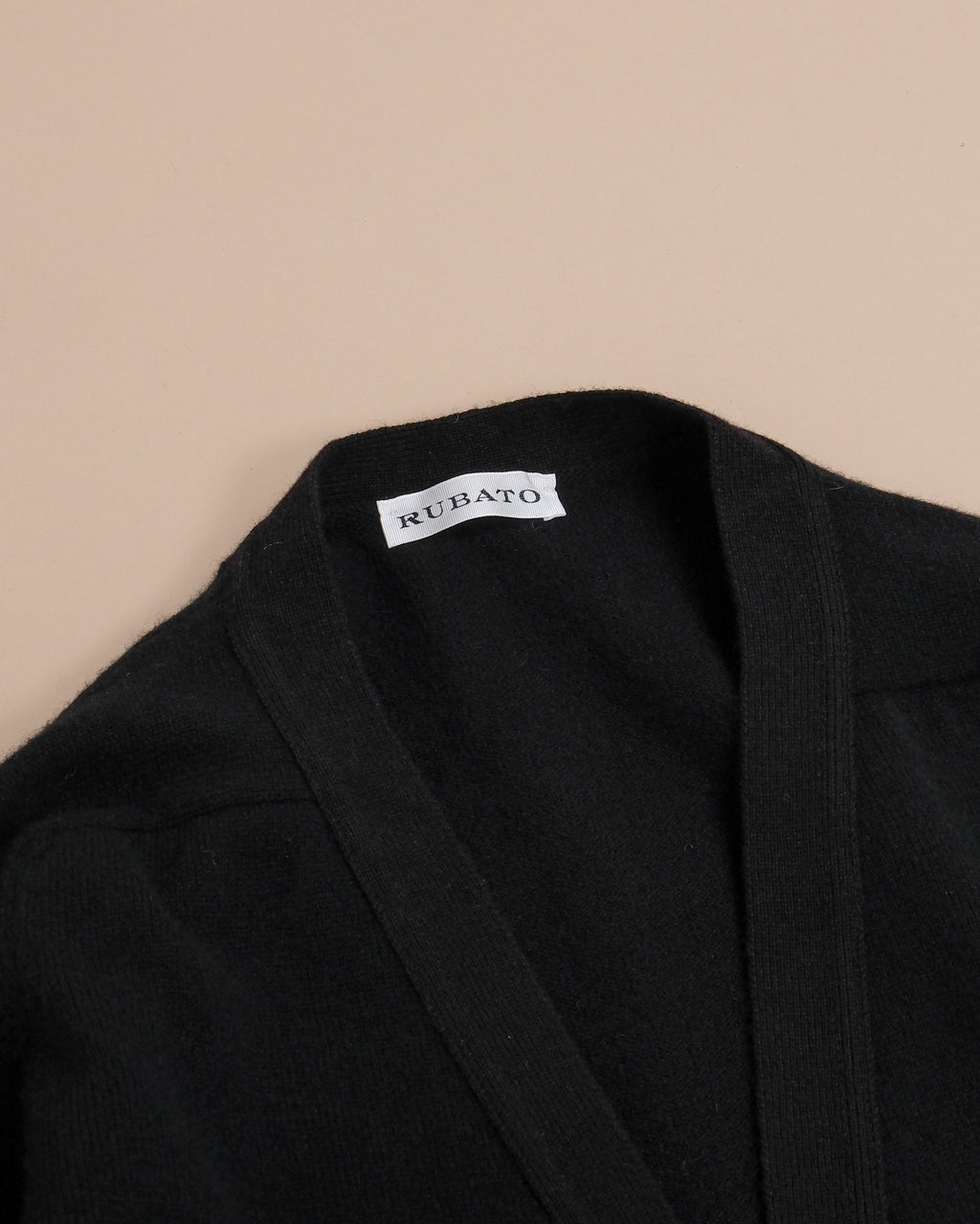 Detail on the generously ribbed deep V-neck on the Black Lambswool Standard Cardigan by Rubato