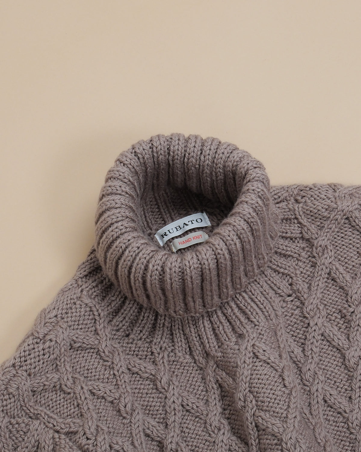 Detail of the generously ribbed rollneck on the Cannon Hand-Knitted Mariner by Rubato.