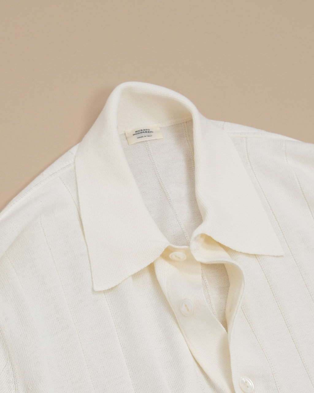 Detail of button placket and collar on Cream Nonpareil Collo Americano Long-Sleeve Polo by Rubato