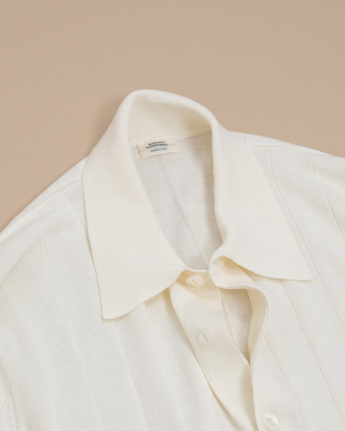 Detail of button placket and collar on Cream Nonpareil Collo Americano Long-Sleeve Polo by Rubato