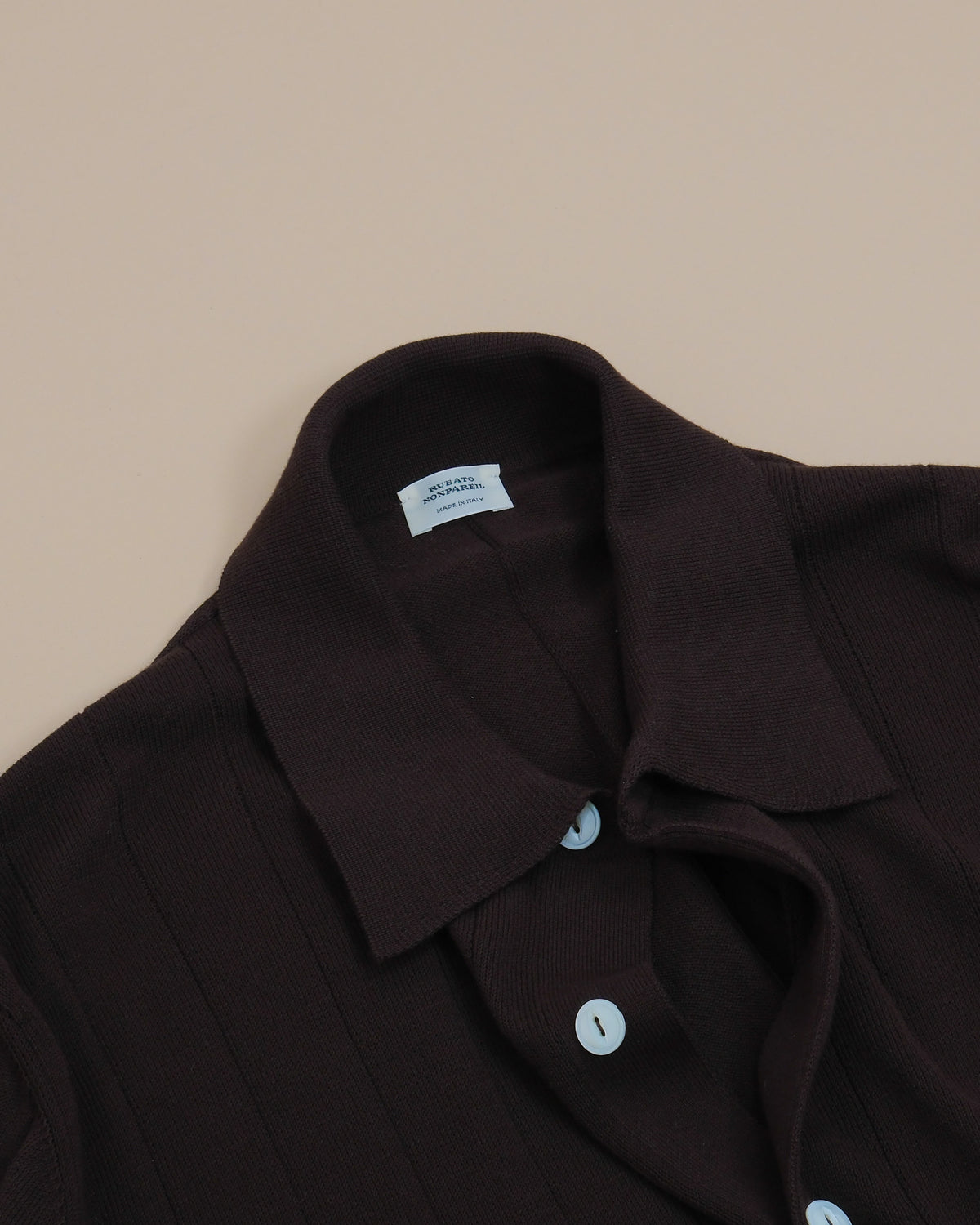 Detail of button plaket and collar on Ebano Nonpareil Collo Americano Long-Sleeve Polo by Rubato