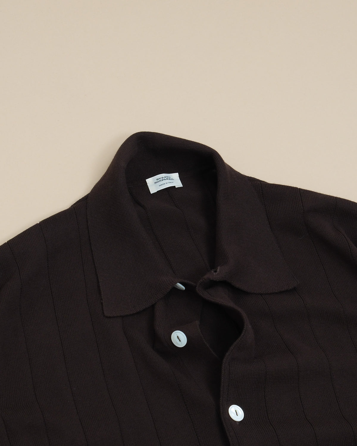 Detail of vutton placket and collar on Ebano Nonpareil Collo Americano Short-Sleeve Polo by Rubato