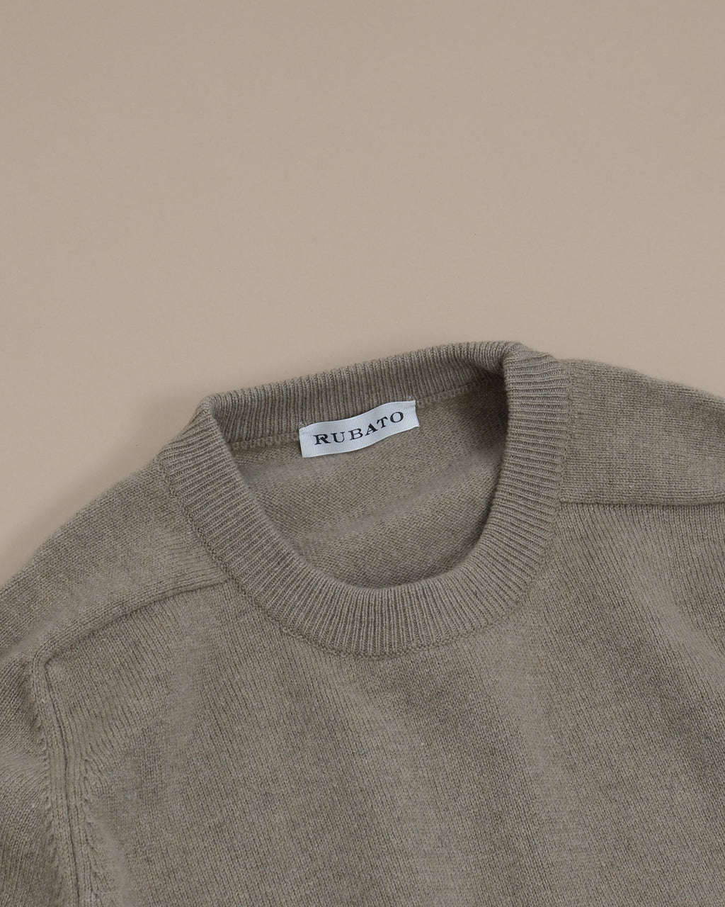 Detail of the ribbed crewneck and saddle shoulder on the Gravel Lambswool Standard Crewneck by Rubato