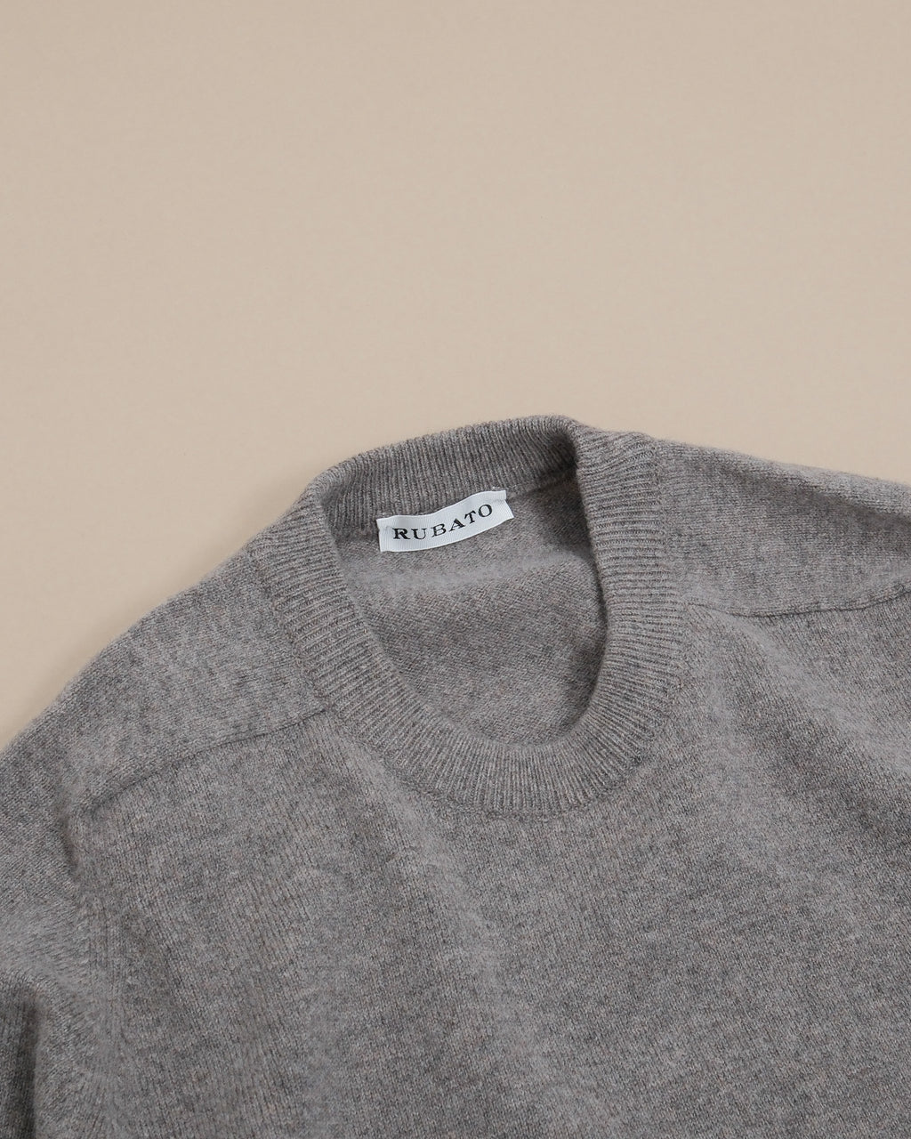 Detail of saddle shoulder and ribbed crewneck on Natural Geelong Lambwool Crewneck by Rubato