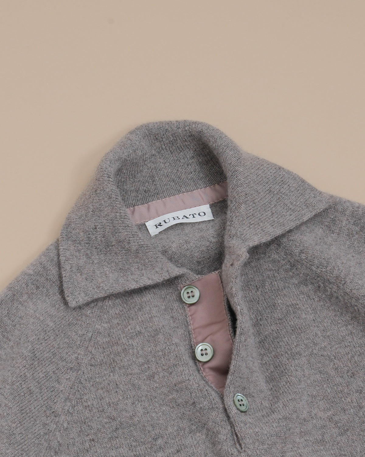 Detail of the generous polo collar, reinforced button placket and mother-of-pearl buttons on the Natural Lambswool Standard Sportsman by Rubato