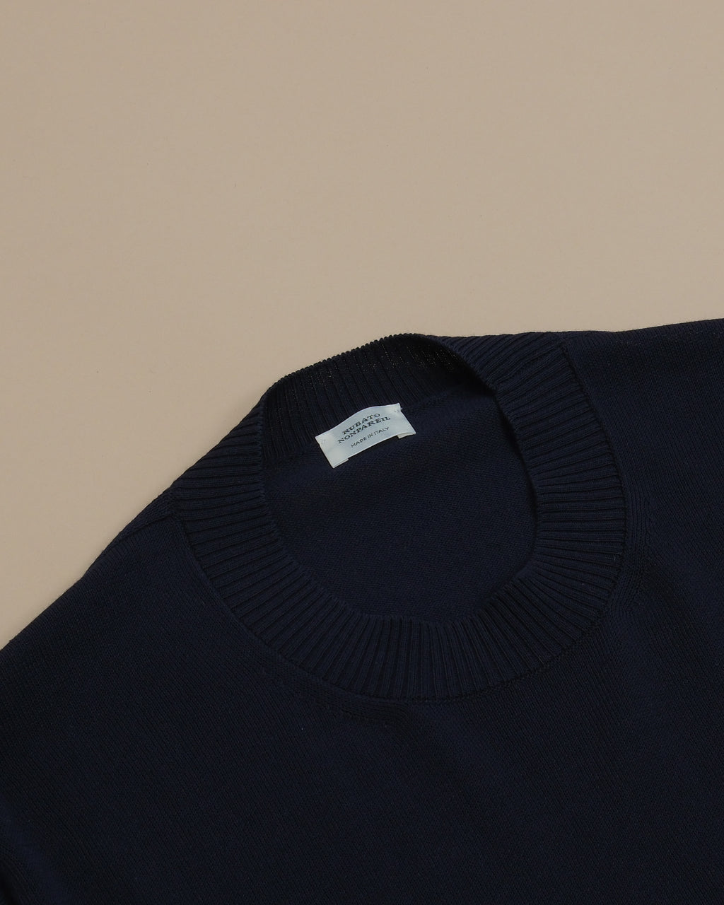 Detail of the generously ribbed neckline on the Navy Cotton Nonpareil T-Shirt by Rubato.