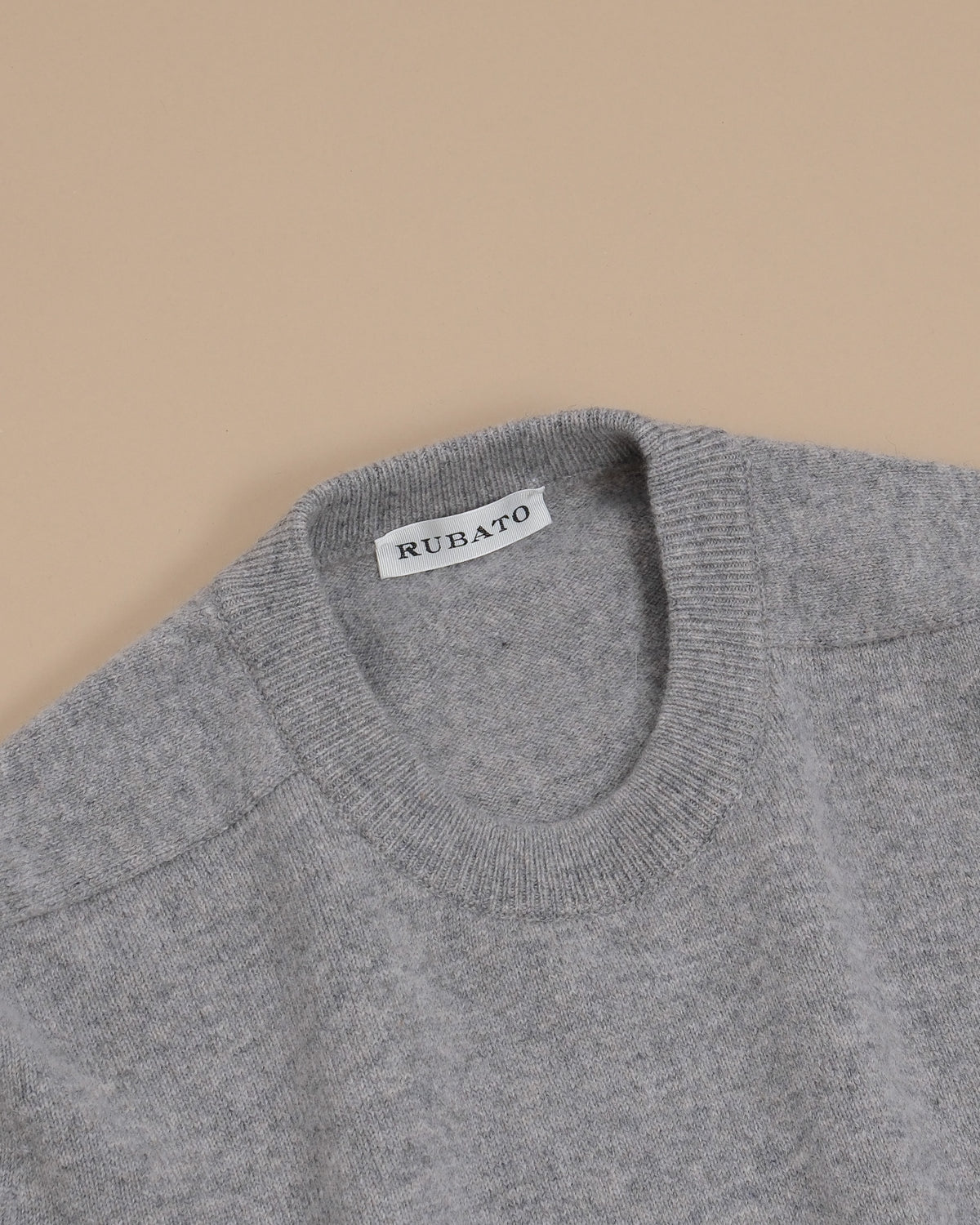 Detail of ribbed collar and saddle shoulder on the Stone Lambswool Standard Crewneck by Rubato
